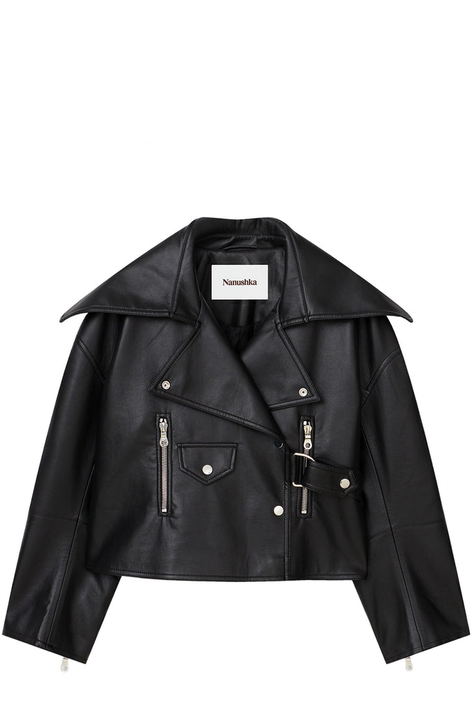 A black faux leather moto jacket with a wide collar, asymmetrical zipper, and silver hardware, shown flat on a white background. The brand label 'Namoka' is visible inside the collar.