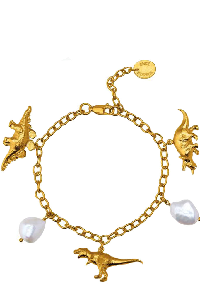 The dinosaur and broque Pearl charm bracelet in gold and pearl colours from the brand ALEX MONROE