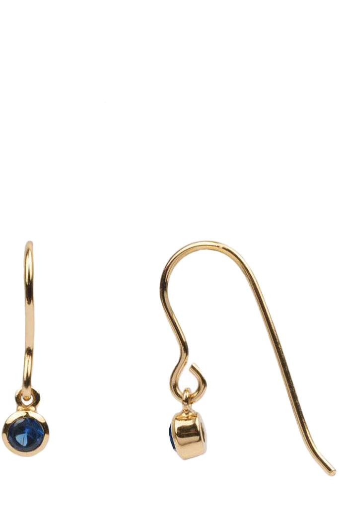 The hook sapphire earrings in gold and blue colours from the brand ALL THE LUCK IN THE WORLD.