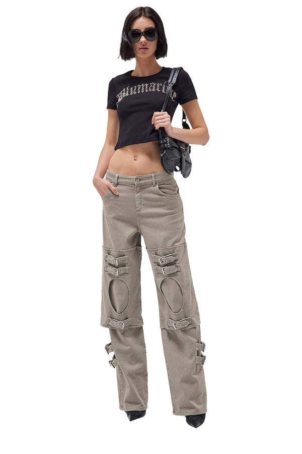 Model wearing the multi belt-detail panelled boyfriend jeans in taupe color from the brand BLUMARINE