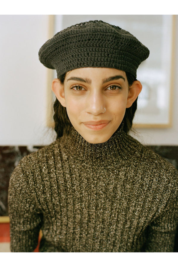 Model wearing the cotton-knit beret in phantom color from the brand GANNI.
