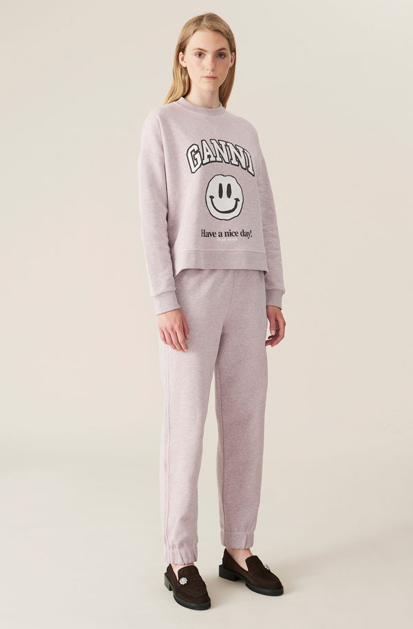 Model wearing The dropped shoulder sweatshirt with smiley print in pale lilac color from the brand GANNI.