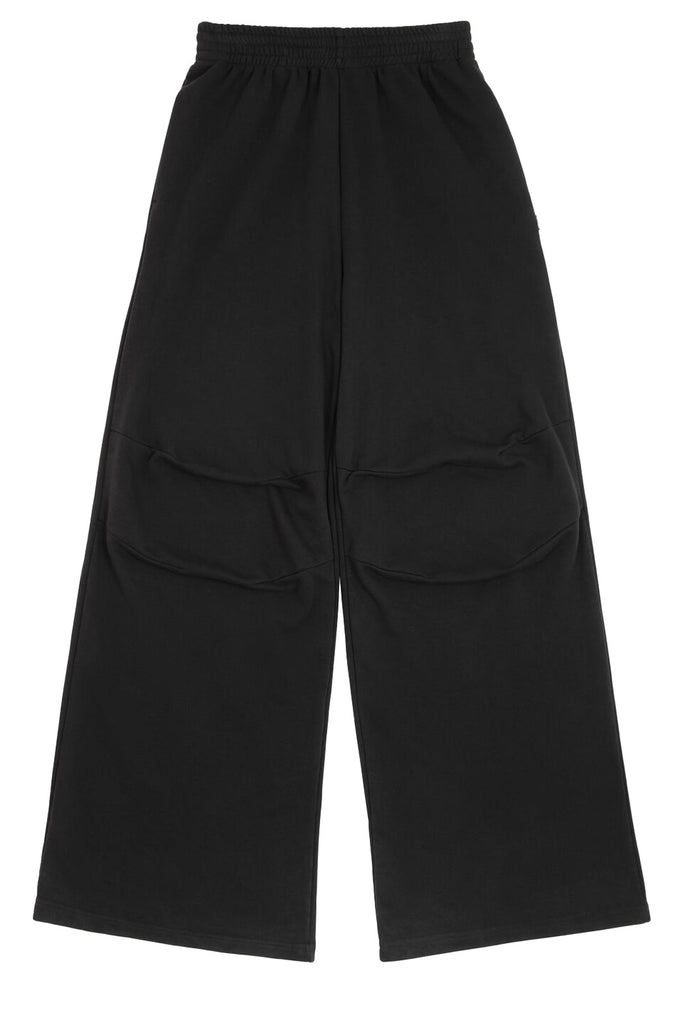 The unbrushed wide-leg pants in black colour from the brand MM6 MAISON MARGIELA