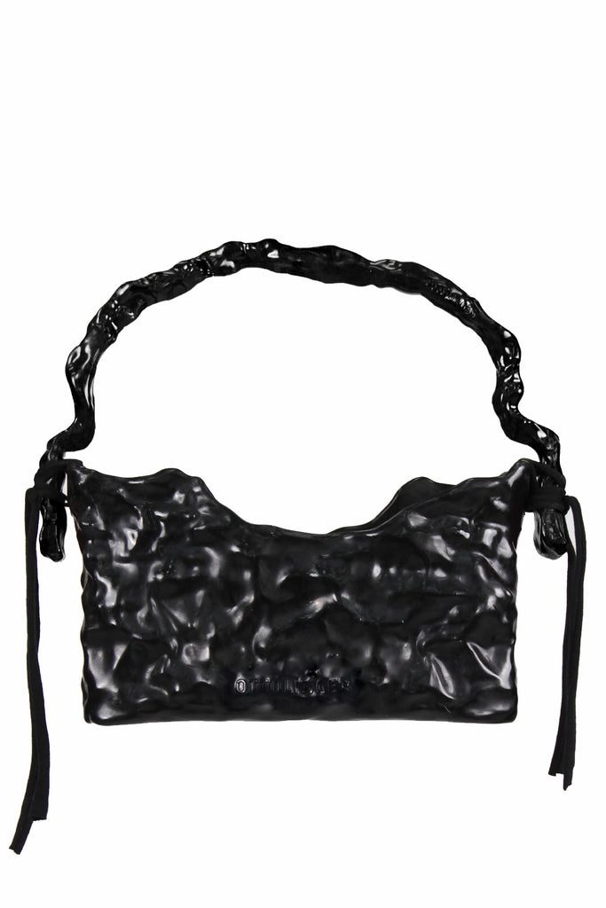The singature ceramic baguette bag in black color from the brand OTTOLINGER
