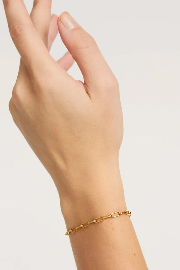 Model wearing the Statement bracelet in gold colour from the brand P D PAOLA