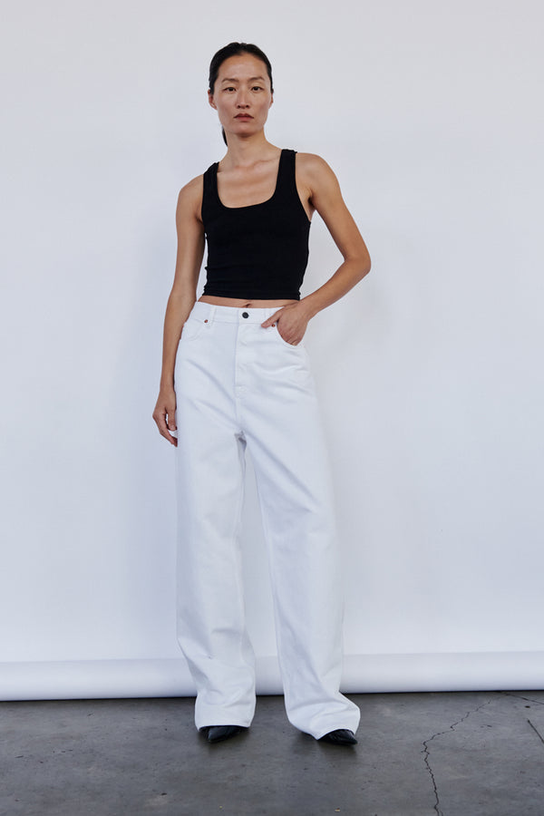 Model wearing the Low-Rise Wide-Leg Jeans in white colour from the brand Wardrobe.NYC