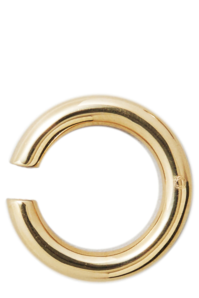 The bold earcuff No3 in warm gold color from the brand Saskia Diez